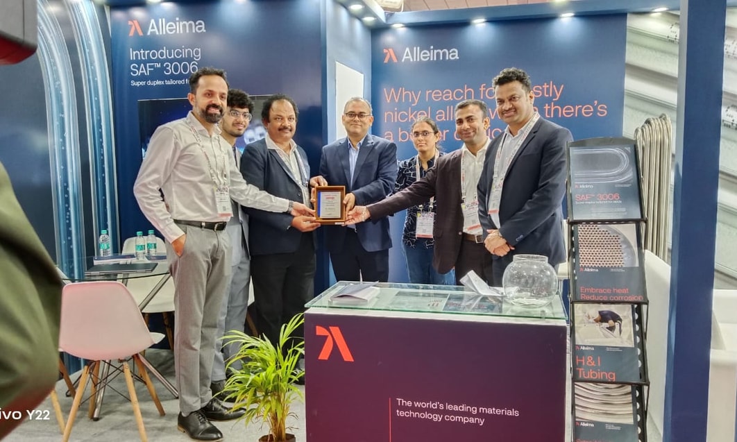 a group of men holding a plaque