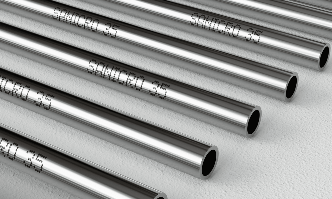 several metal pipes with writing on them