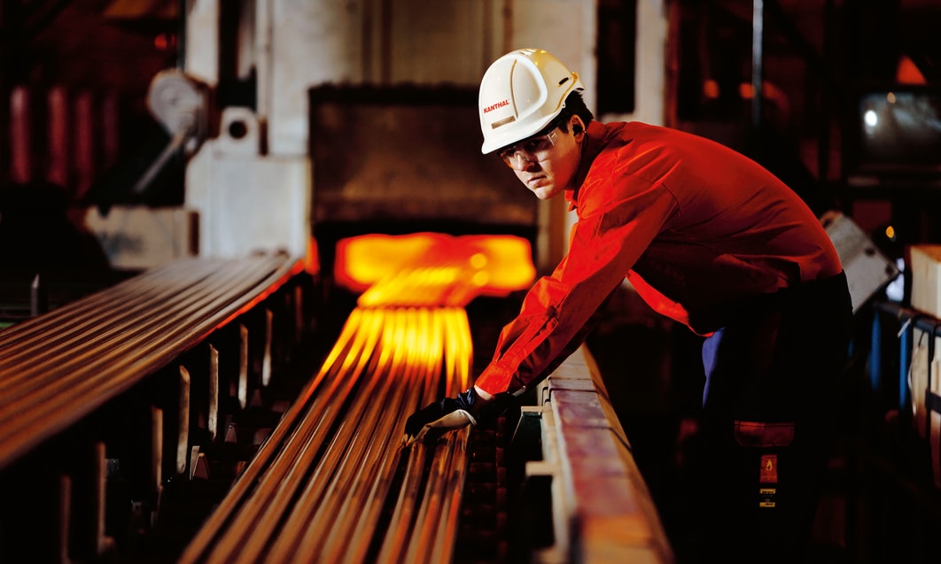 a person in a hard hat and red shirt