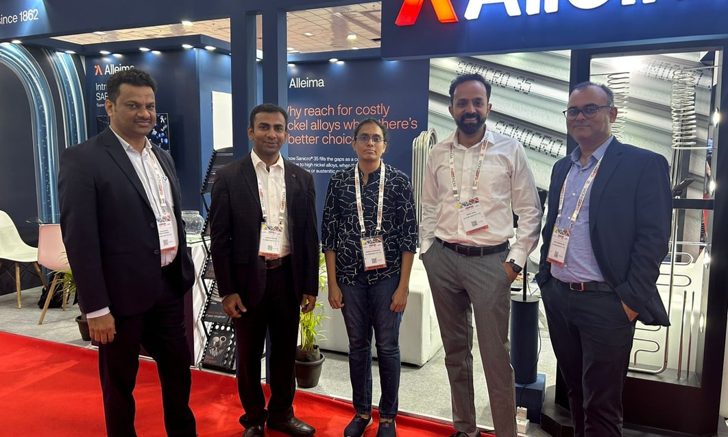 a group of people standing in front of a sign