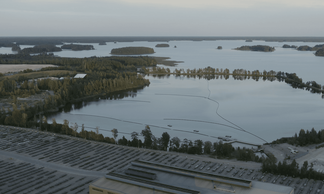 a body of water with trees and buildings