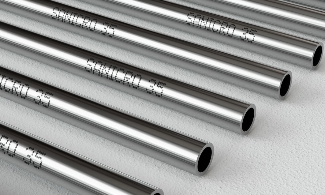 several metal pipes with writing on them