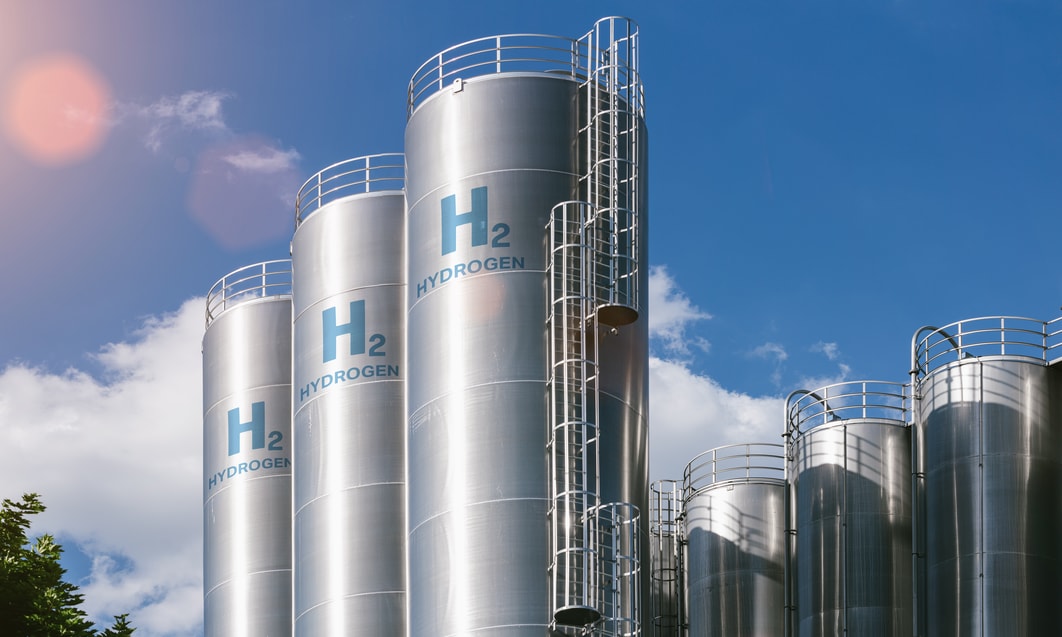 a group of silver silos with blue text