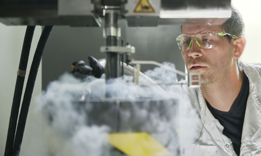 a person wearing goggles and safety glasses