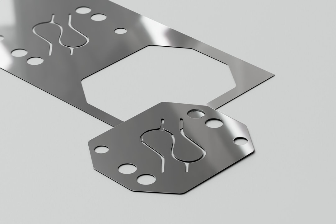 a metal plate with holes