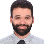 a person with a beard and mustache wearing a tie