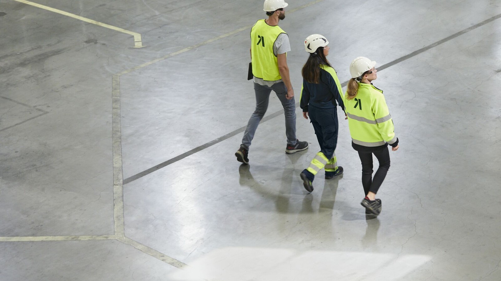 a group of people walking in a building