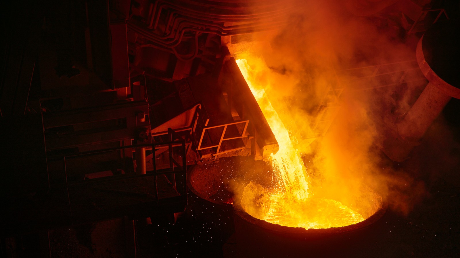 a large container with liquid pouring out of it