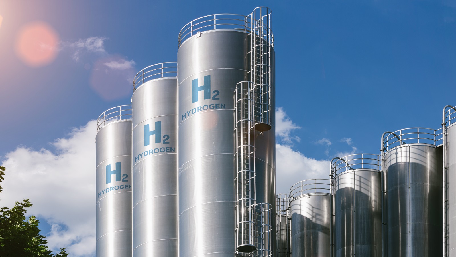 a group of silver silos with blue text