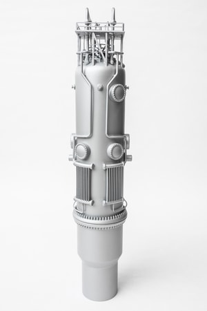 a silver cylinder with knobs