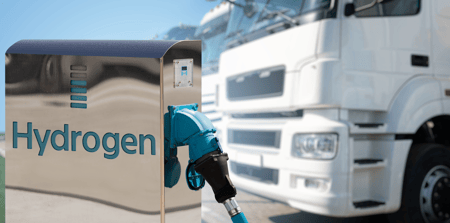 a blue fuel nozzle at a gas station