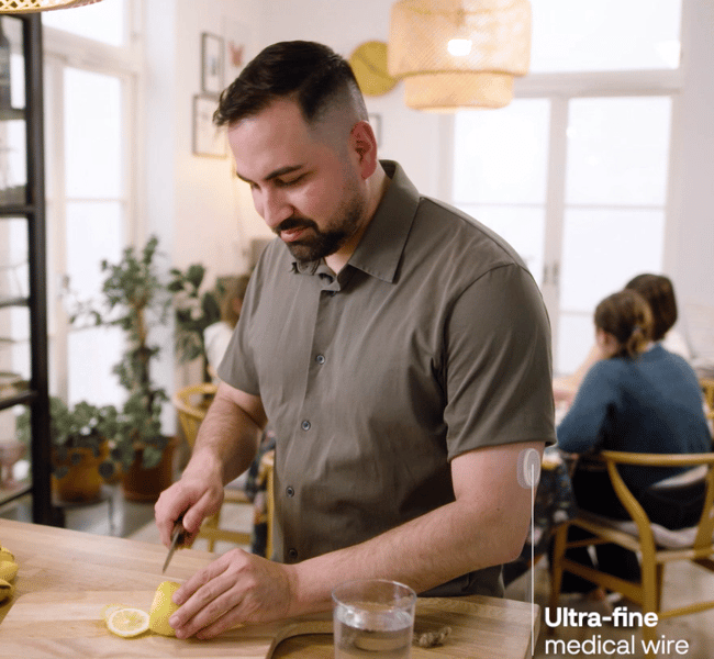 a person cutting a lemon