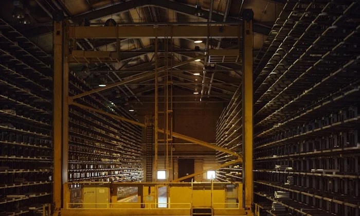 a large warehouse with shelves of goods