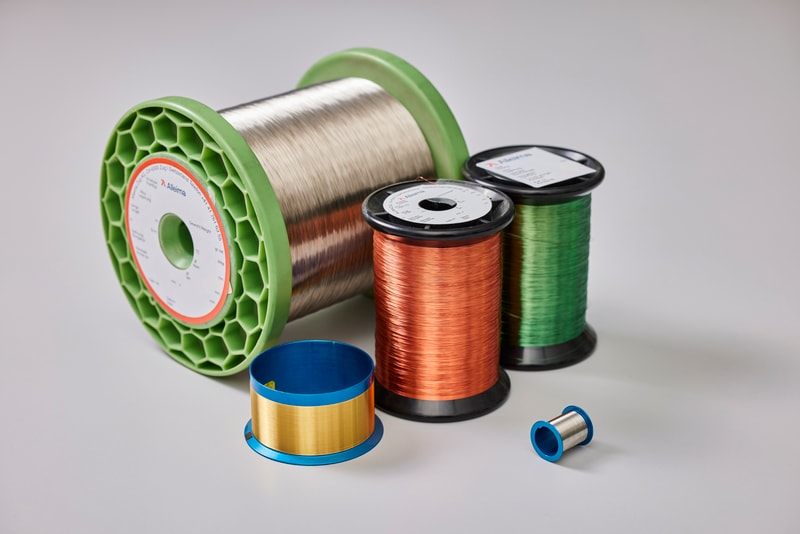 a group of spools of wire