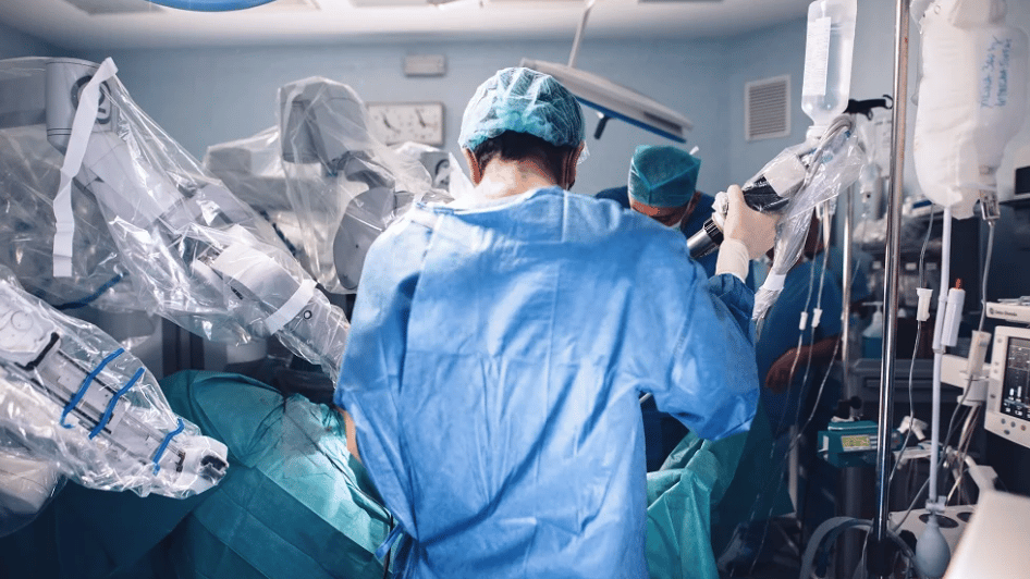 a group of surgeons in a operating room
